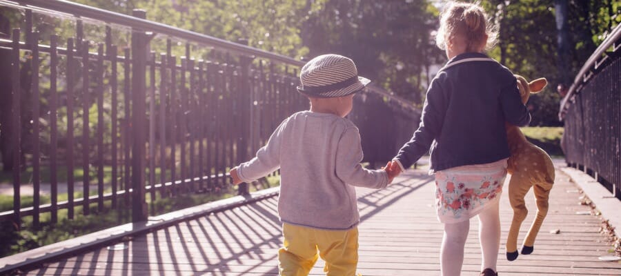 CHECT photo - stock photo of two children holding hands