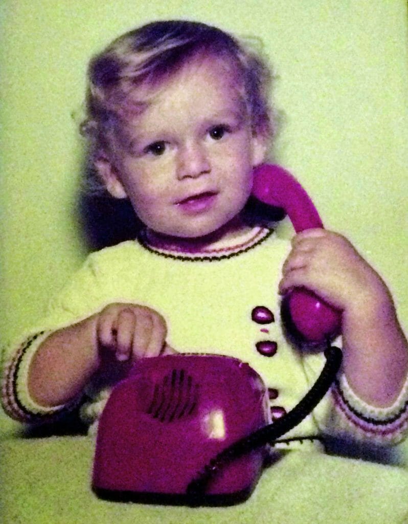 CHECT photo - Matt Holt as a small child, playing with a red phone