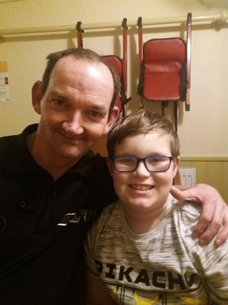 CHECT photo - Thomas Lawson with his dad Robin, both smiling at the camera