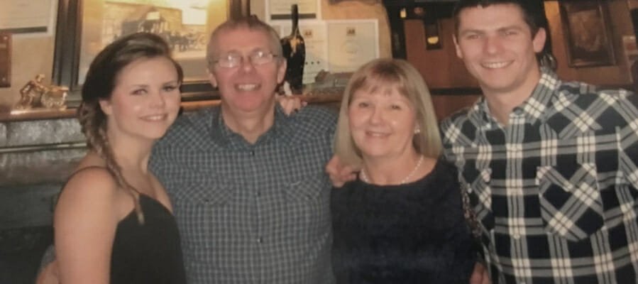 Photo of Kate with her mum dad and brother