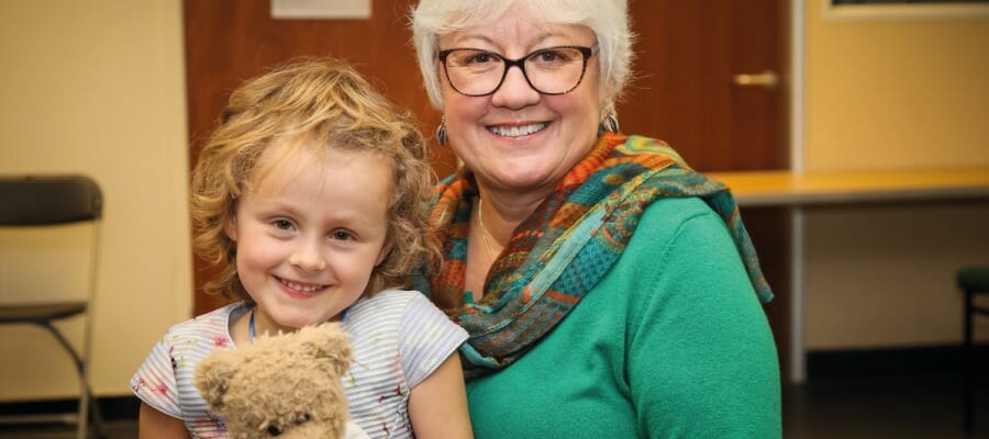Lesley Geen and a child CHECT member