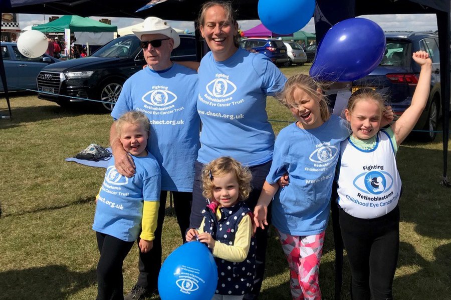 A family with CHECT t-shirts and balloons