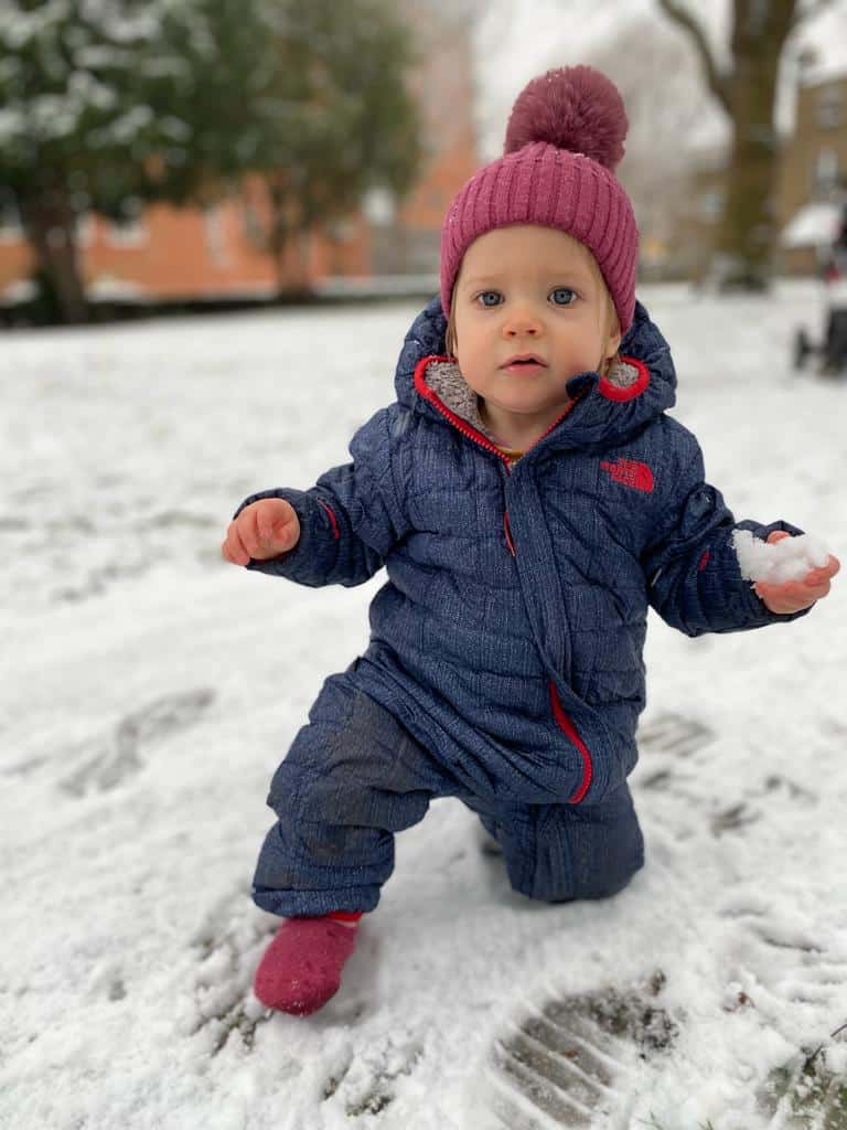 Isla playing in the snow before she was diagnosed with retinoblastoma - eye cancer