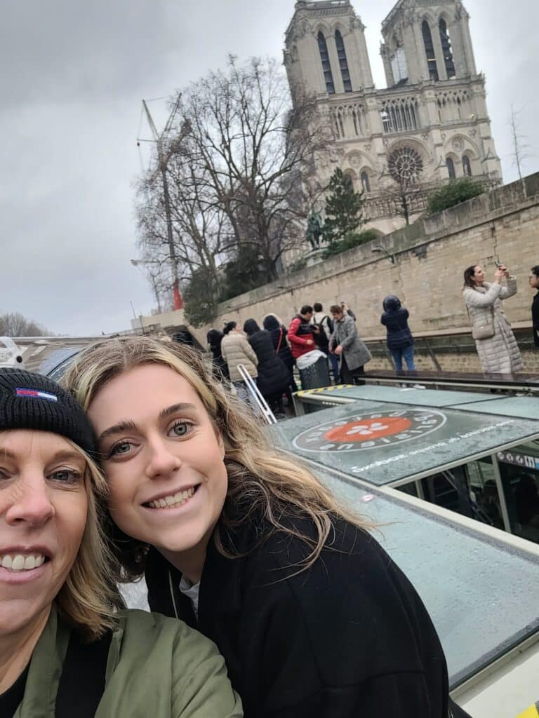 Kay with her daughter Maisy who had retinoblastoma, eye cancer, stood by a landmark