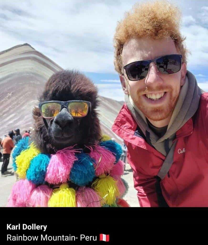 Karl wearing sunglasses with a llama