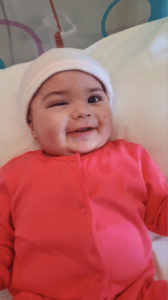 Shuhd smiling as a baby