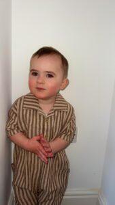 Kooper stood on his own in a stripey outfit