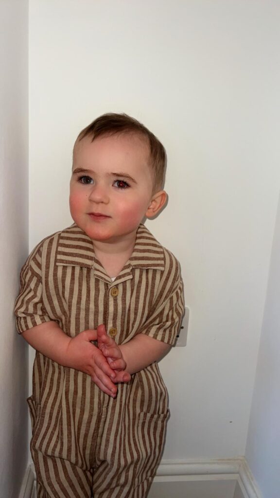 Kooper stood on his own in a stripey outfit