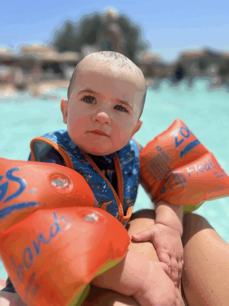 Kooper at a pool, he has a squint