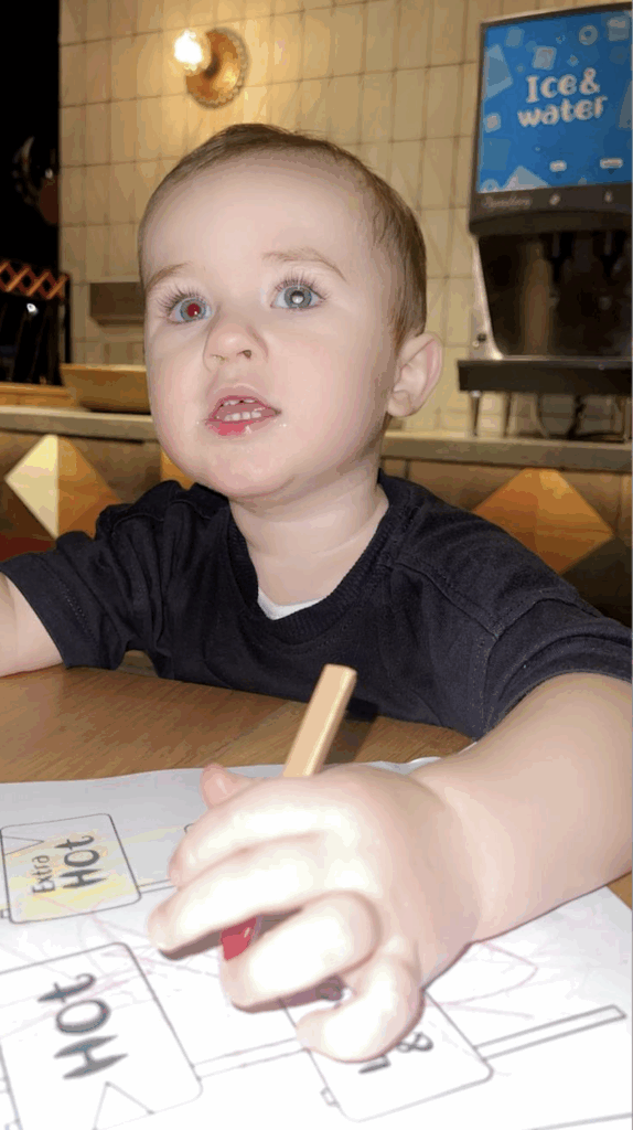 Kooper is colouring, One eye appears red and the other white