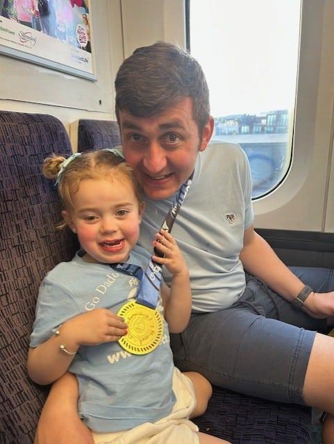Jessy with her dad, wearing a CHECT top