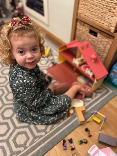 Jessy playing with her toys