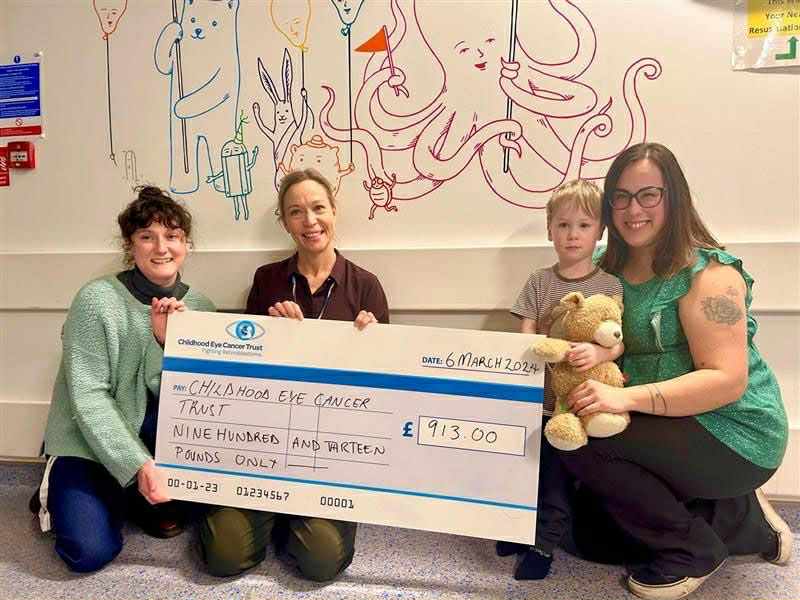 Jamie and his mum Ilaria handing over a cheque to CHECT following a fundraising event at Jamie's nursery 