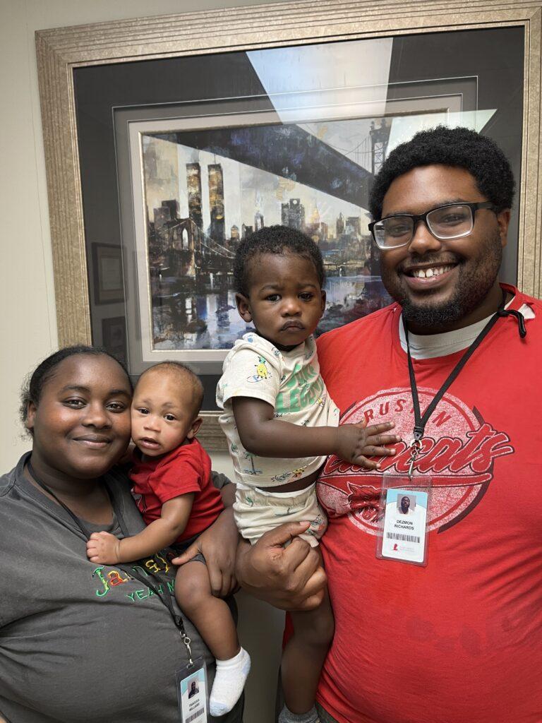 Kaois with his parents and sibling all smiling